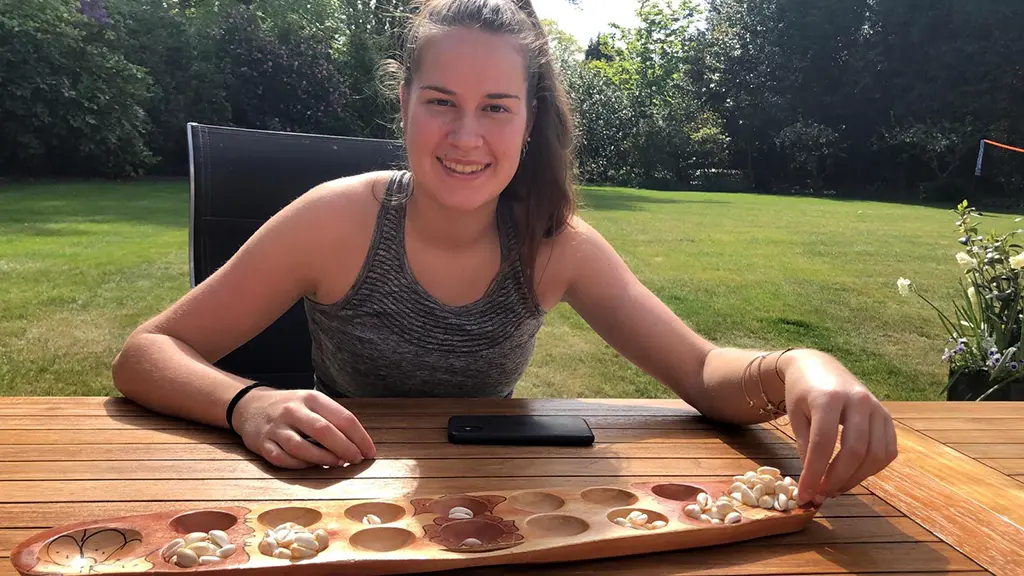 Playing Sungka – the Filipino version of Warri