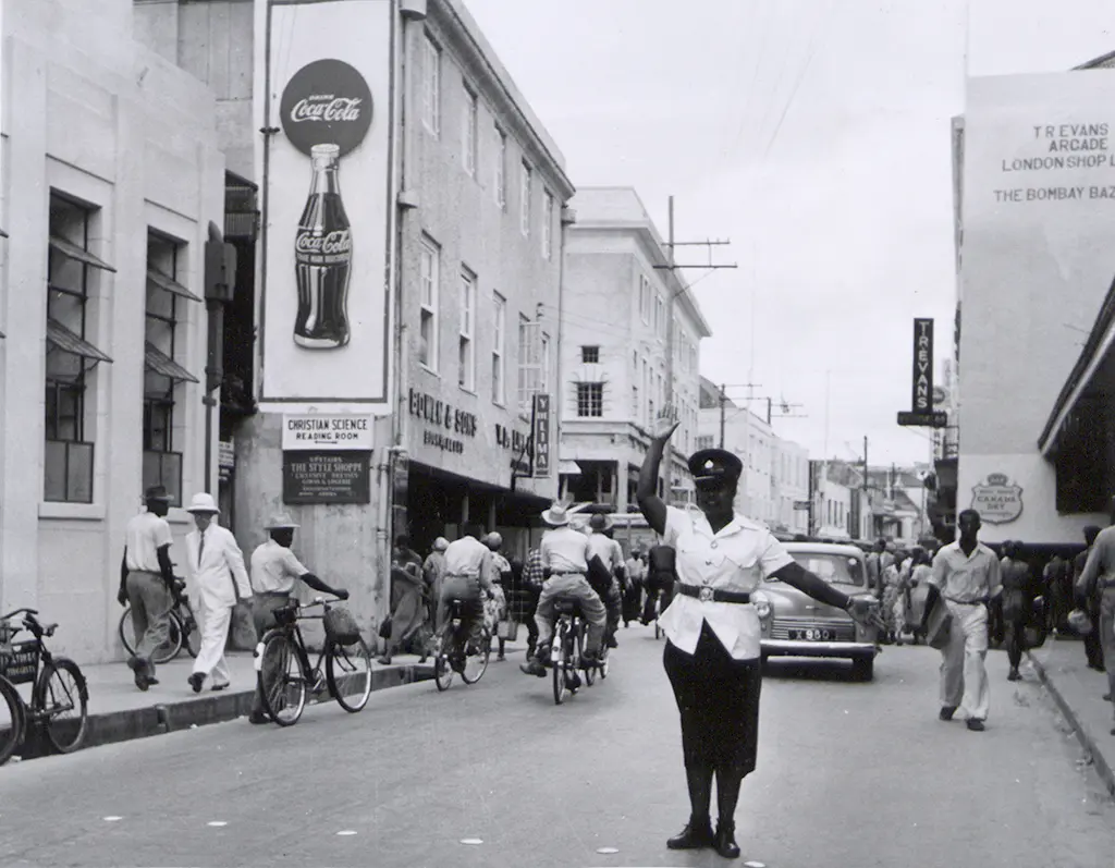 Policewoman controlling traffic Broad Street Bridgetown