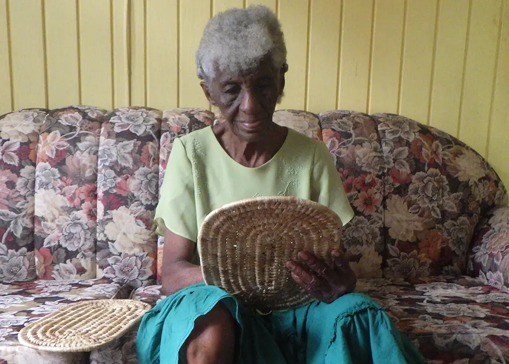 Jean Forde at home weaving